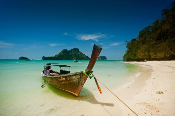 A boat on the shore of the Andaman Sea